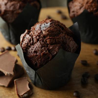 Concept of delicious food with chocolate muffins, close up.